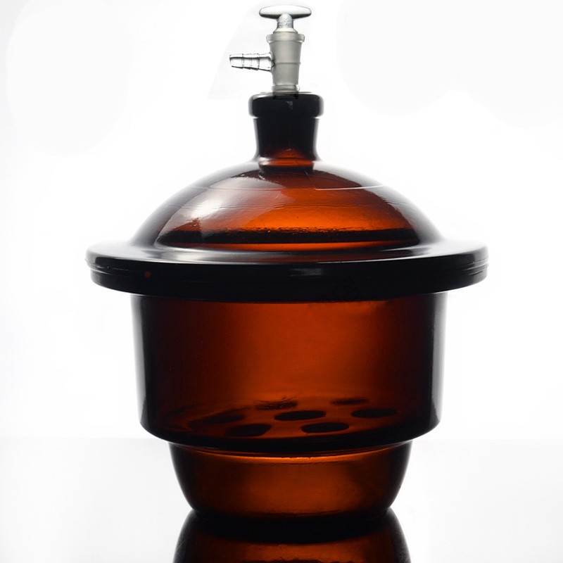 VACUUM DESICCATOR amber,with ground-in stopcock and porcelain plate